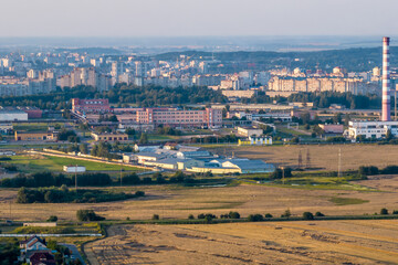 aerial panoramic view from a great height of a small provincial town with a private sector and high-rise apartment buildings