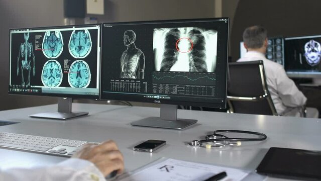 Doctors In Office Using Computers