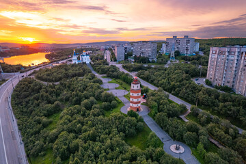 Murmansk, Russia - July 16, 2022: Aerial view panorama of city memorial Lighthouse northern city sunset - obrazy, fototapety, plakaty