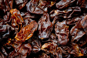 Close-up shot of freshly dried dark-colored raisins.