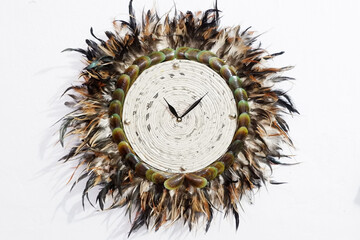 wall clock made of chicken feathers