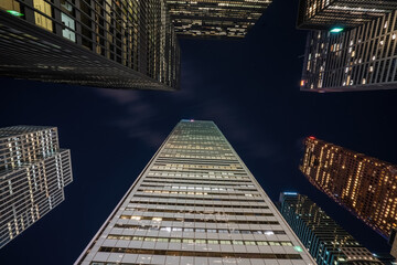Toronto skycrapers from below looking up with long exposure clouds blurred