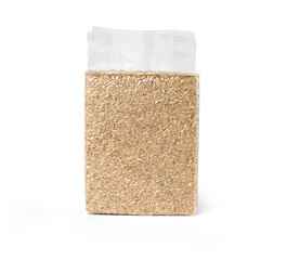 Brown rice in transparent plastic vacuum sealed bag