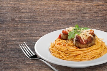 Pasta Spaghetti in plate with sauce, italian cuisine dish.