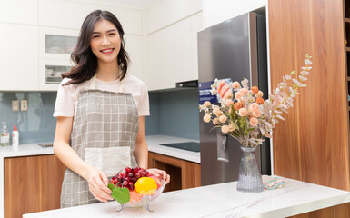 Image of young Asian woman at home