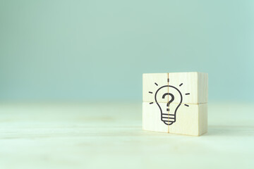 Question marks and light bulb symbolizing idea or solution. Problem solving skill, creativity,...