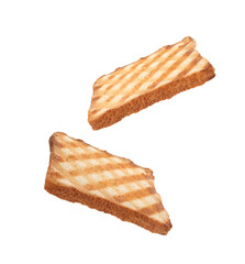Delicious toasted bread flying on white background