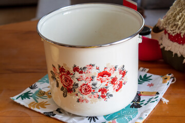 A cooking pot with flower print on it