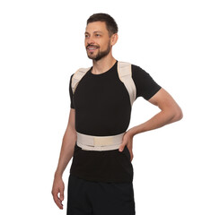 Handsome man with orthopedic corset on white background