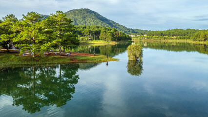 Fototapeta na wymiar The lake and mountains magical view in Da Lat, Vietnam
