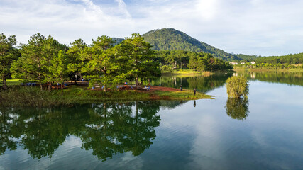 Fototapeta na wymiar The lake and mountains magical views in Da Lat, Vietnam
