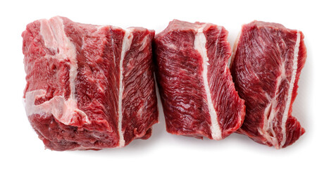Beef cut into pieces close-up on a white background. Top view