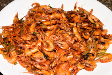 Testy river shrimps on white dish