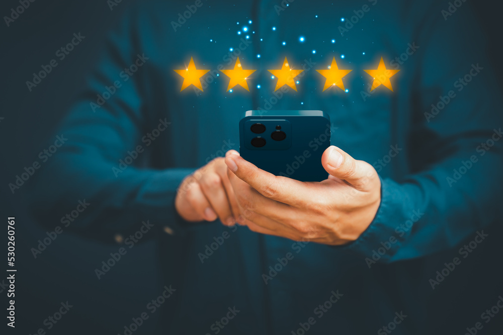 Poster Man's hand using a smartphone and give five star symbol to increase rating of product and service concept, Customer service experience, testimonial and business satisfaction survey.