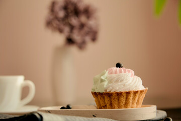 Atmospheric tea time, cozy home, breakfast. Cake sweets with cup of black tea. Autumn aesthetic. Seletive focus