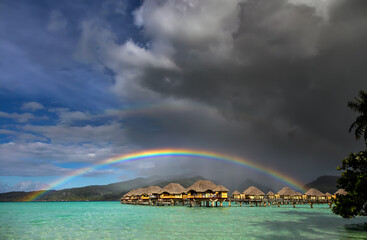 Rain shower creating Multicolored rainbow Bora Bora Resort