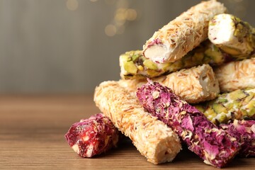 Turkish delight dessert on wooden table, closeup. Space for text