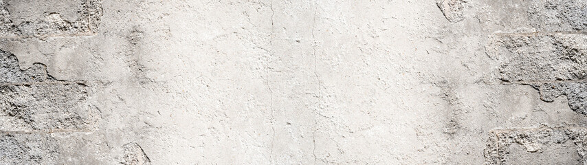 Old aged damaged cracked grunge white grey gray concrete cement plaster facade wall texture background banner long pattern