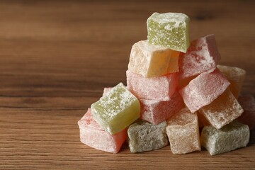 Turkish delight dessert on wooden table, closeup. Space for text