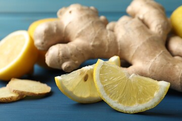 Fresh lemon and ginger on blue wooden table, closeup