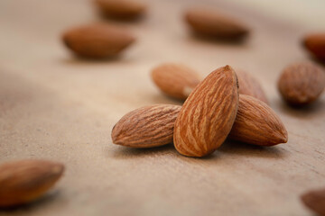 almonds on the brown wooden table background