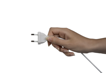 the electric plug in the female hand on an isolated background