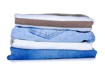 Stack folded cloth jeans sweaters on white background isolation
