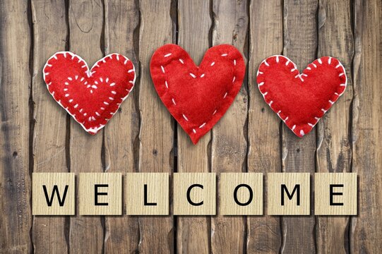 Heart and wooden blocks with "WELCOME" word