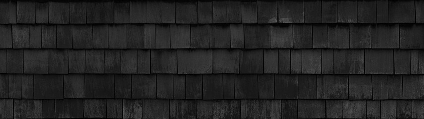 Old black gray grey rustic dark wooden shingle wall facade texture - wood background textured...