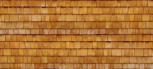Old brown rustic light bright wooden shingle wall facade texture - wood background textured pattern.