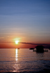 Naklejka na ściany i meble Sunrise with boat ship. West Bali, Indonesia