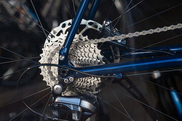 Close-up of rear wheel of road bike. Disc brakes and sprocket.