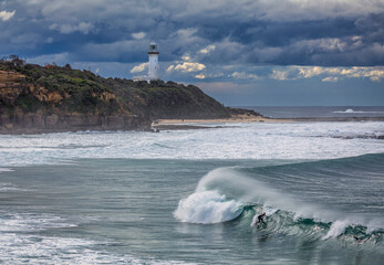 surfer and lighthouse