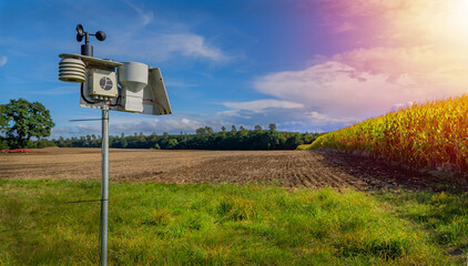Modern and digital agriculture with a weather station when the weather is nice. - obrazy, fototapety, plakaty