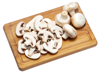 Sliced white champignon mushrooms on wooden cutting board isolated