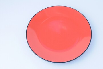 Red plate isolated on white background 