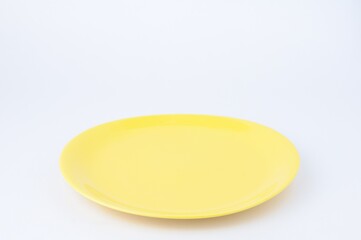 yellow plate isolated on white background 