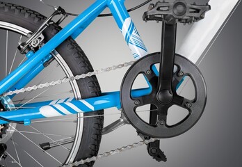 Fototapeta na wymiar Hydraulic bicycle, grey metal disc attached to bike wheel, effective popular mountain bicycle brakes.
