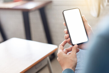 cell phone blank white screen mockup.hand holding texting using mobile on desk at office.background empty space for advertise.work people contact marketing business,technology