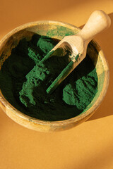 Blue-green algae Chlorella and spirulina powder in bamboo eco bowl, dietary supplement for Vegan,...