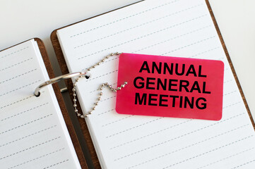 A card with the text AGM Annual General Meeting