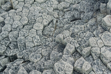 natural stone background, the bases of lava basalt columns form a kind of pavement