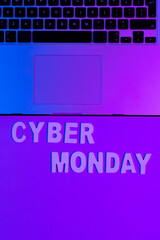 Naklejka premium Image of cyber monday text and laptop with copy space over neon purple background