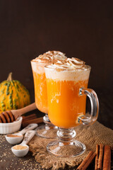 Orange Pumpkin Spice Latte with Whipped Cream for Autumn Holidays.