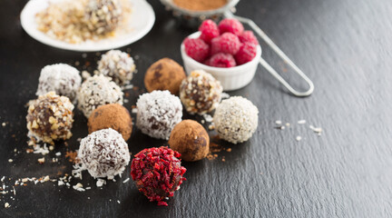 Fototapeta na wymiar Homemade sugar free Chocolate Candy Balls with Cocoa Powder and Nuts