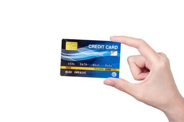 woman hand holding blank white credit card with blurred abstract background of multicolored cotton clothing on the shelves of fashion shop