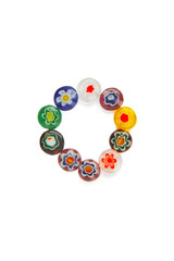 Subject shot of a elegant ring made out of acrylic beads bright hand-painted. The stylish elegant ring with a hand painted acrylic beads with a floral decor is isolated on the white background.