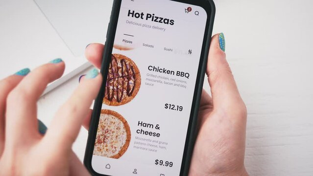 Woman ordering pizza online. Pizzeria store app for mobile phone.