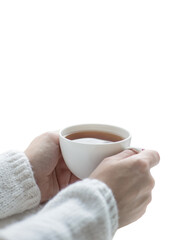 Tea drinking. The woman in a knitted, white pullover holds a cup of hot tea in her hands isolated on white background. Cozy weekends, winter drinks.