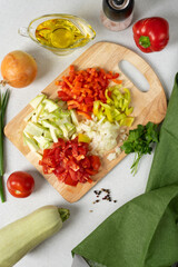 vegetable pie or quiche with slice. cut vegetables.